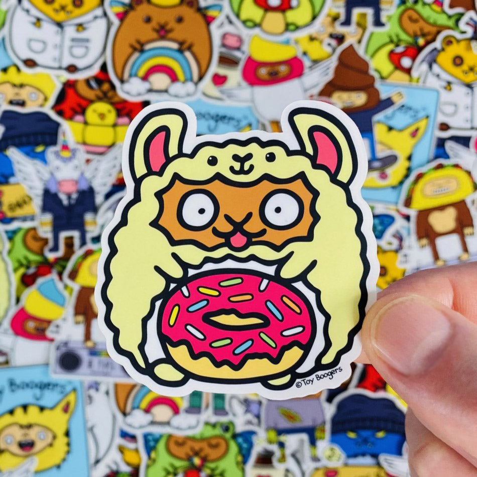 Cute sticker of a hamster in a llama costume going crazy for donuts.