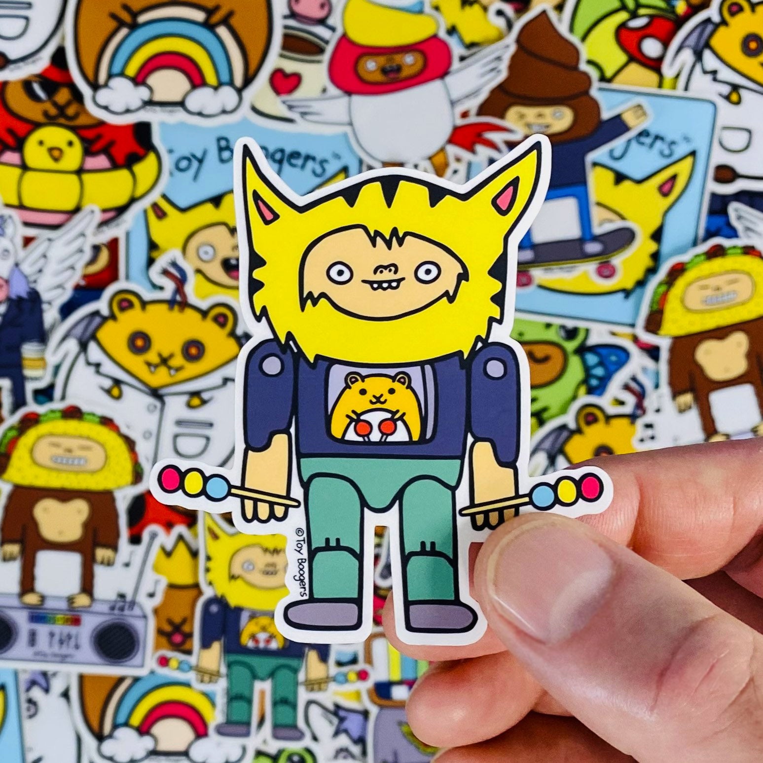 Funny sticker of a Hamster-Controlled Cat-Headed Action Figure cartoon.