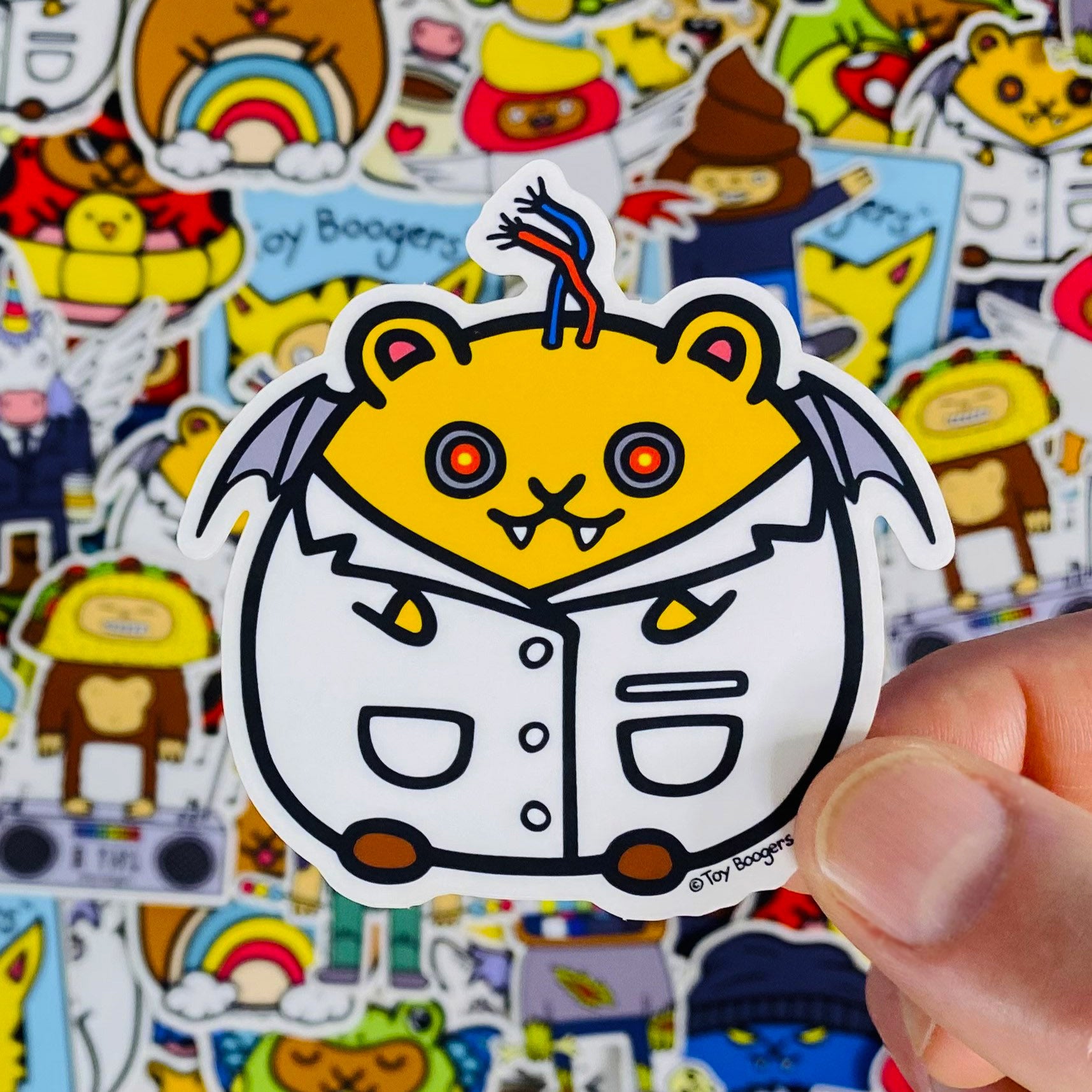 Funny and wacky sticker of a cyborg vampire hamster wearing a lab coat with wires sticking out of his head and wings on his back.